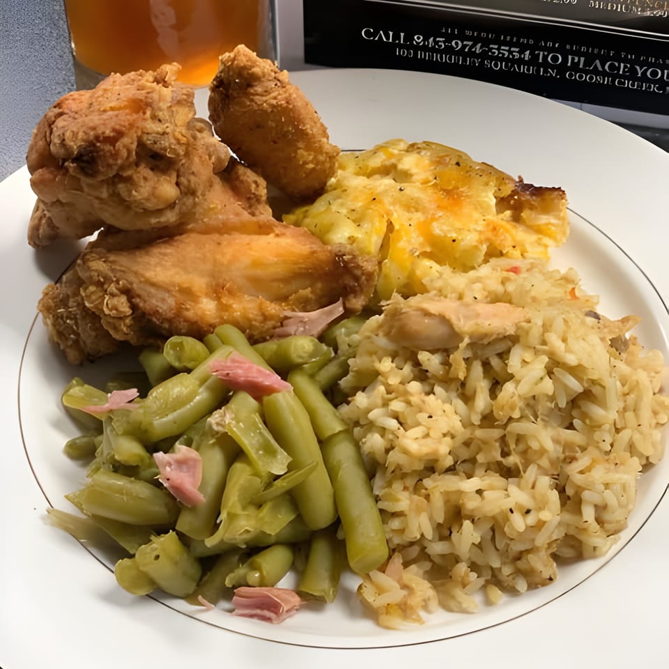 Gail's Soul Food plate with fried chicken, mac and cheese, green beans, and rice.