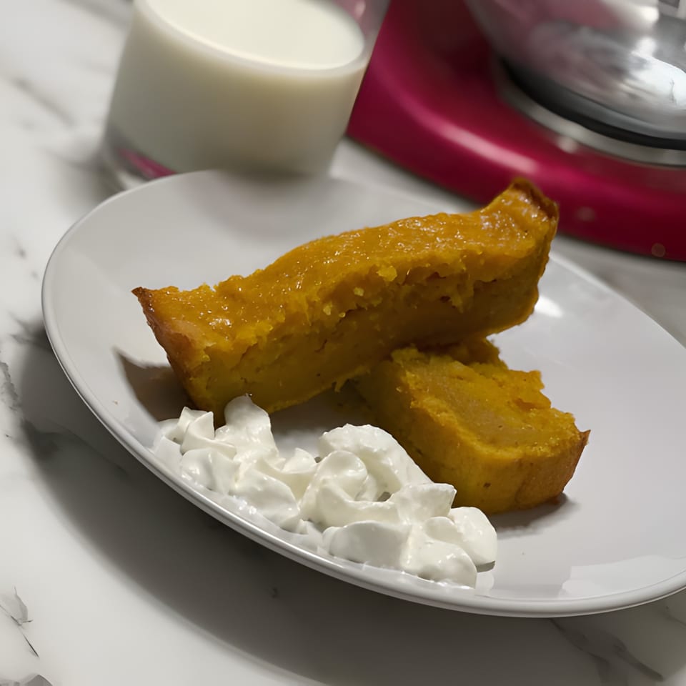 Two slices of Gail's Soul Food sweet potato pie with whipped cream, milk, and a mixer.