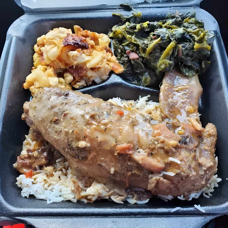 Gail's Soul Food takeout with smothered chicken, rice, mac and cheese, and collard greens.